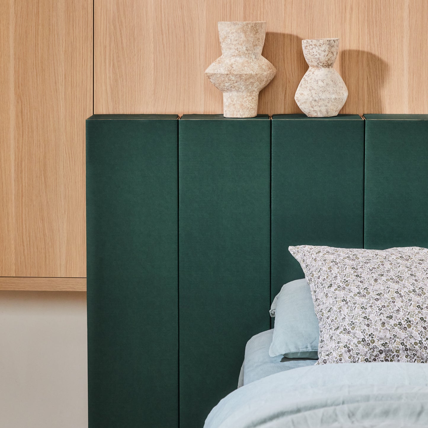 Close up photo showing the sleek design of Yona headboard in green finish