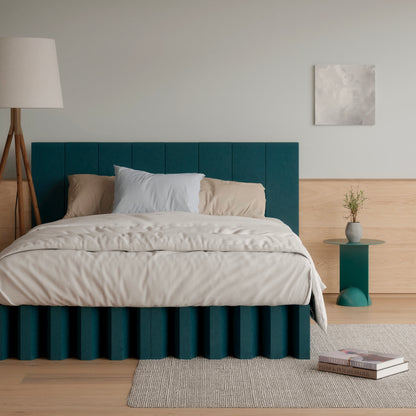 Yona Cardboard Bed with headboard in forest green finish displayed in a minimalist bedroom